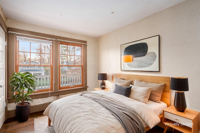 bedroom with hardwood / wood-style floors