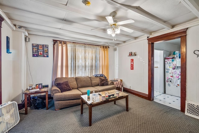 carpeted living room featuring beamed ceiling and ceiling fan