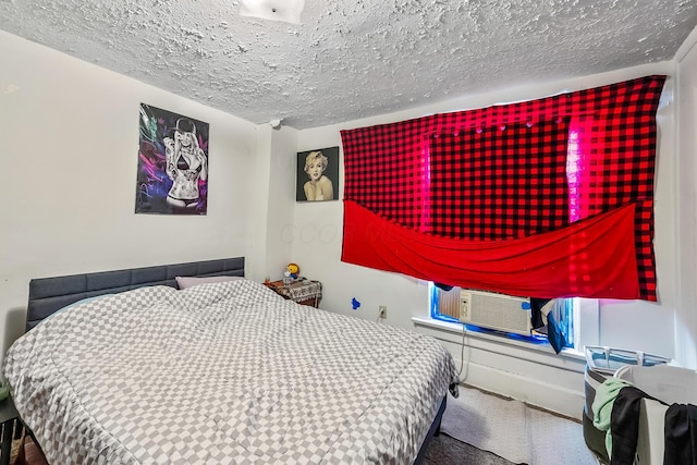 bedroom with cooling unit, carpet floors, and a textured ceiling