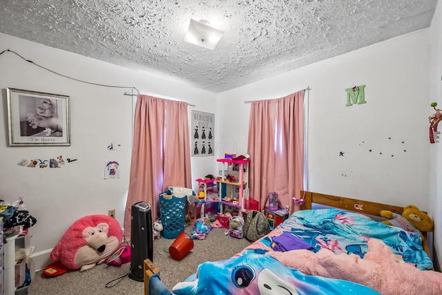 carpeted bedroom featuring a textured ceiling