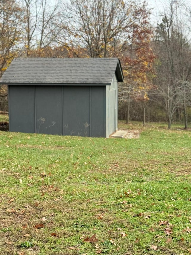 view of outdoor structure featuring a lawn