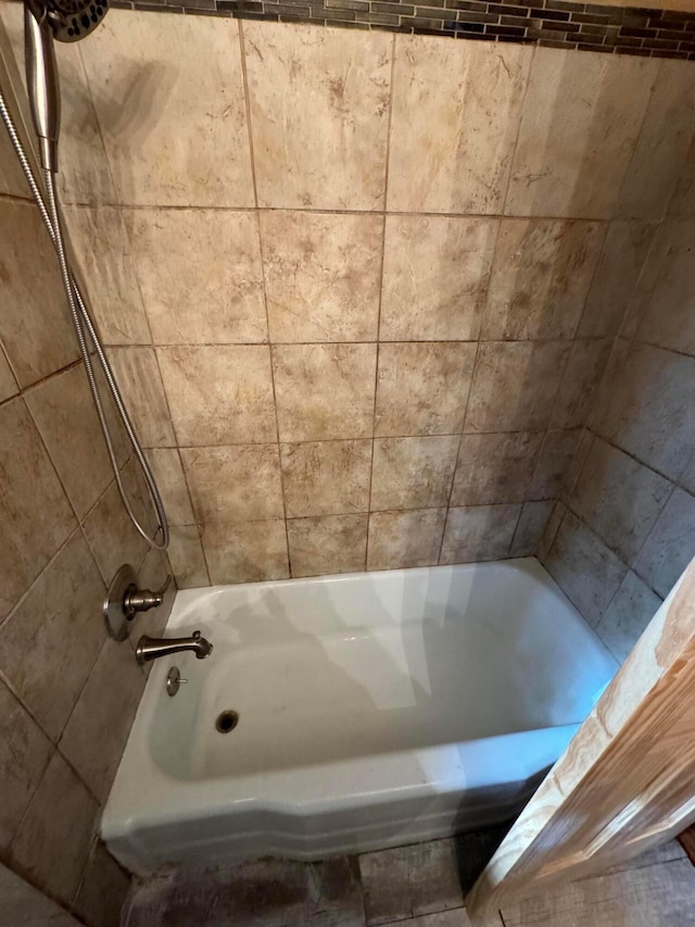 bathroom with shower / tub combo with curtain