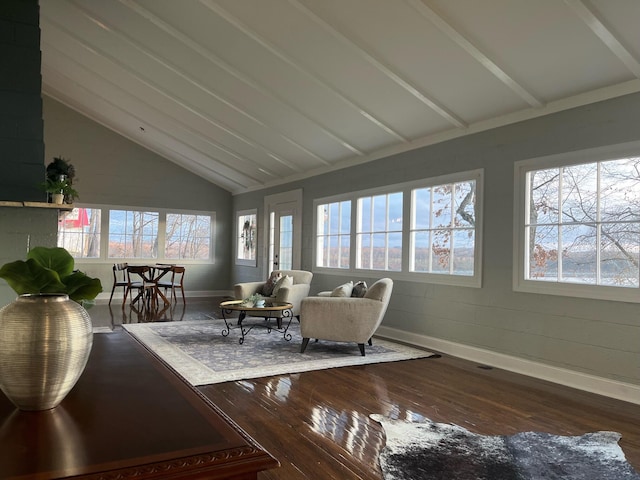 sunroom featuring lofted ceiling