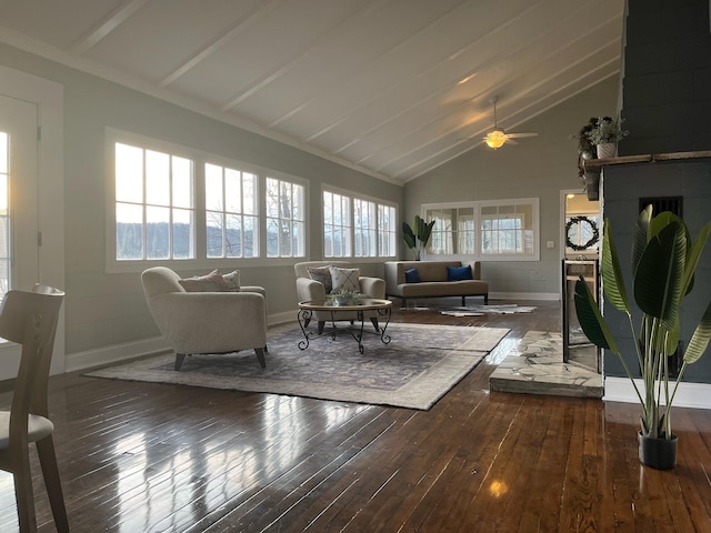 living room featuring a fireplace, dark hardwood / wood-style flooring, high vaulted ceiling, and ceiling fan