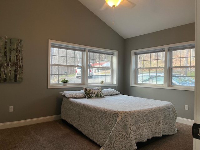 carpeted bedroom with vaulted ceiling and ceiling fan