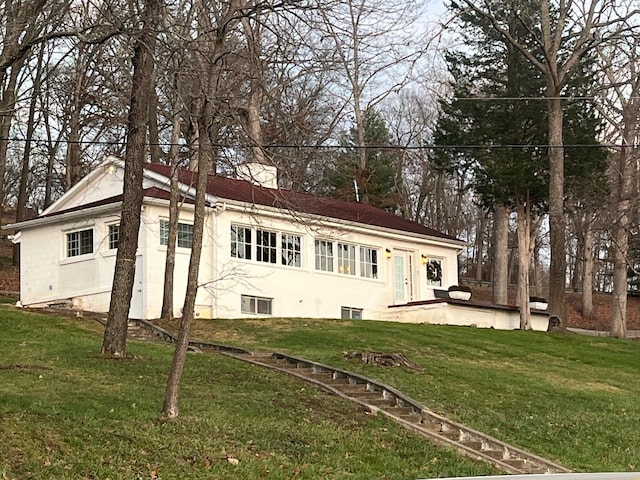 back of house with a yard