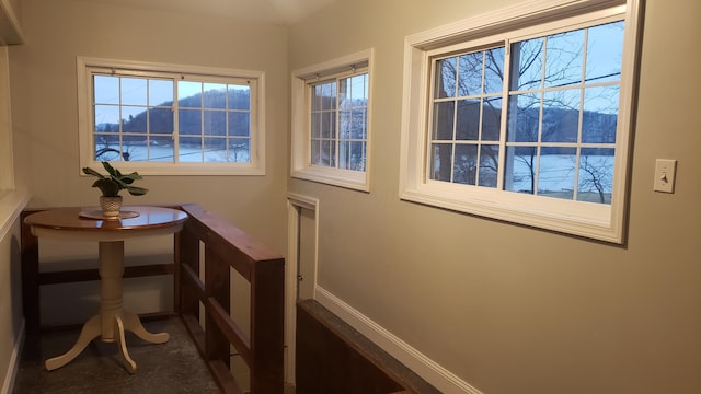 doorway to outside with a water and mountain view