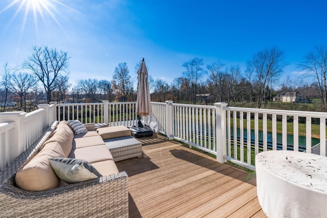 wooden terrace with outdoor lounge area