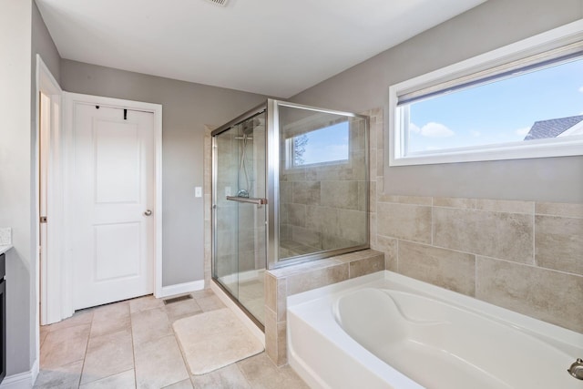 bathroom with tile patterned flooring, vanity, and separate shower and tub