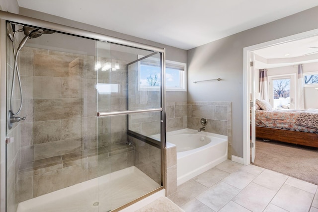 bathroom featuring tile patterned floors and independent shower and bath