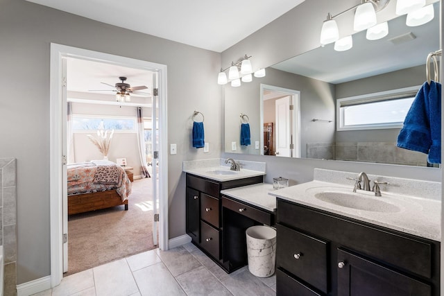 bathroom featuring tile patterned flooring, ceiling fan, and vanity