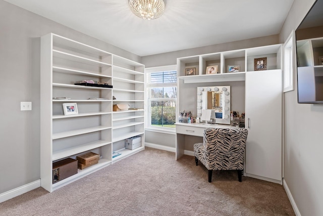 walk in closet featuring light carpet