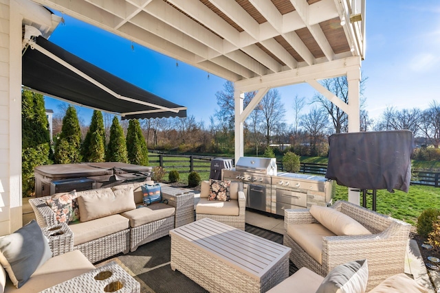 view of patio featuring an outdoor hangout area, exterior kitchen, and grilling area