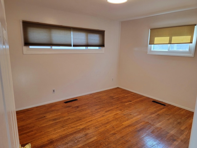 empty room featuring hardwood / wood-style floors