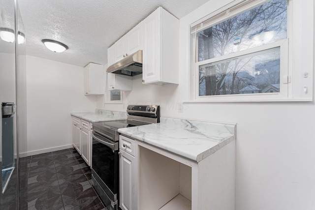 kitchen with a textured ceiling, white cabinetry, light stone countertops, and stainless steel range with electric stovetop