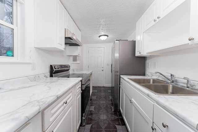 kitchen with white cabinets, electric range oven, and sink