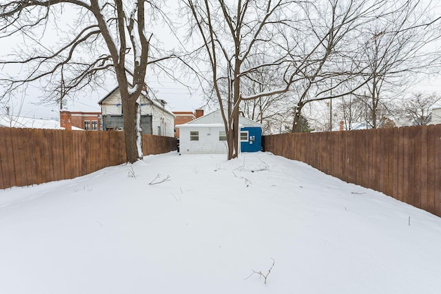 view of yard layered in snow