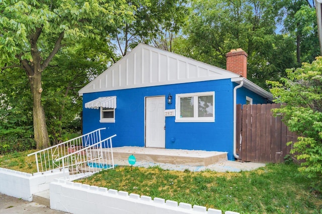 view of outbuilding with fence