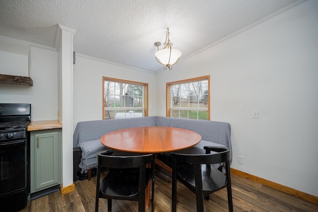 dining area featuring a textured ceiling, crown molding, and dark wood-type flooring