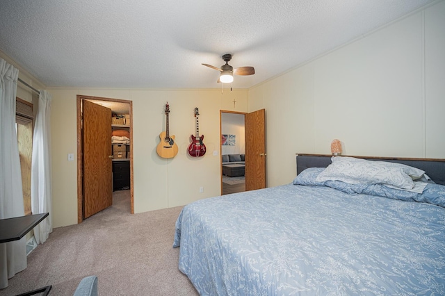 bedroom featuring a textured ceiling, ceiling fan, lofted ceiling, and light carpet