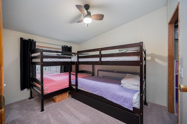 bedroom featuring carpet, a textured ceiling, vaulted ceiling, and ceiling fan