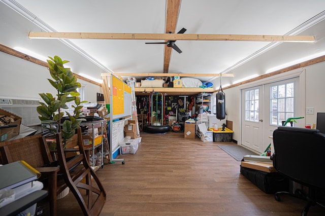 interior space featuring hardwood / wood-style flooring, vaulted ceiling with beams, and ceiling fan