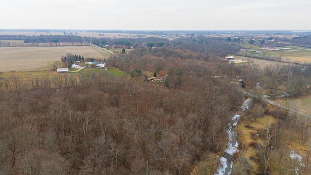 birds eye view of property with a rural view