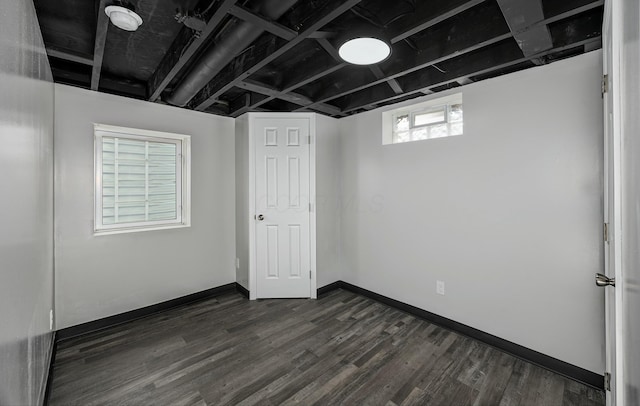 basement featuring dark wood-type flooring