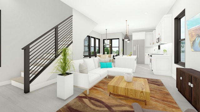 living room with sink and a notable chandelier