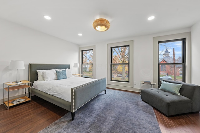 bedroom with dark wood-type flooring