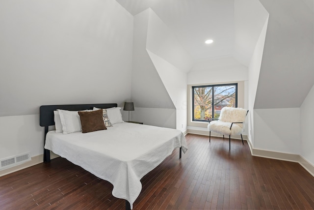 bedroom featuring dark hardwood / wood-style flooring and vaulted ceiling