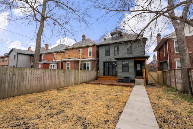 rear view of property with a deck