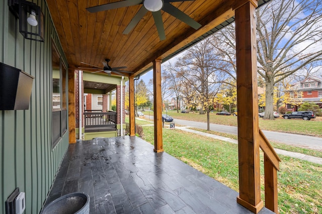 view of patio with ceiling fan and a porch