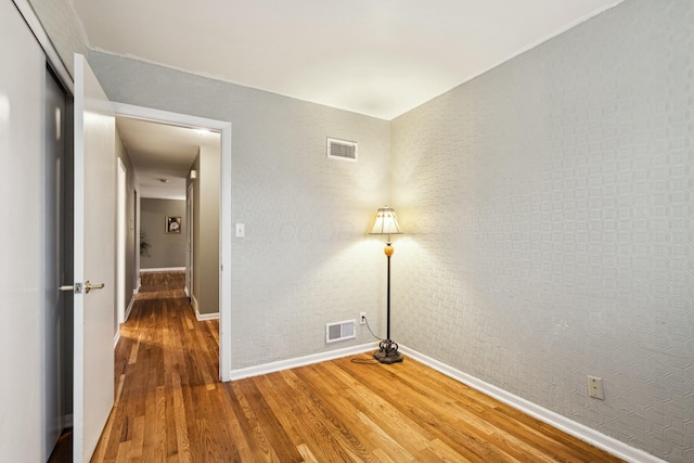 empty room with wood-type flooring