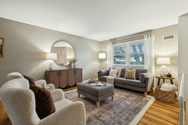 living room with light hardwood / wood-style flooring