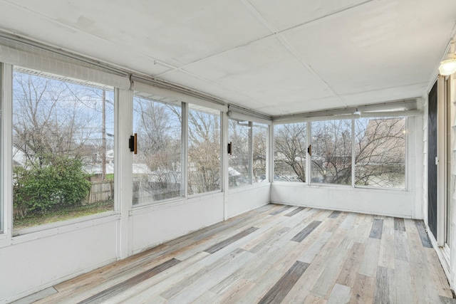 unfurnished sunroom featuring a wealth of natural light