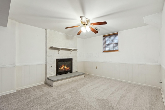 unfurnished living room with ceiling fan and light colored carpet