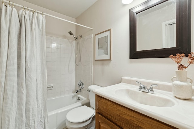 full bathroom with vanity, shower / bath combo, and toilet