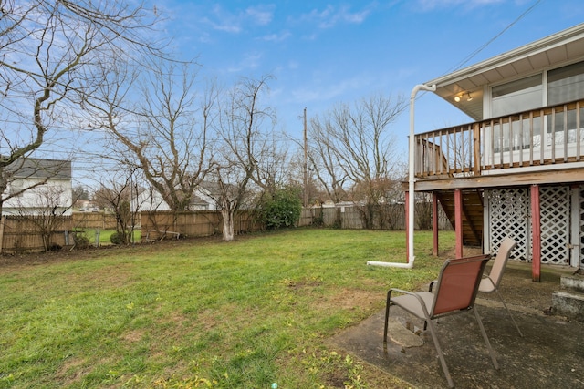 view of yard with a patio and a wooden deck