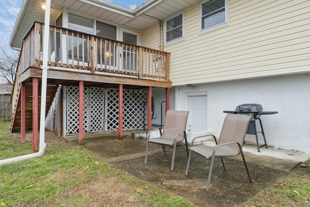 back of house with a wooden deck