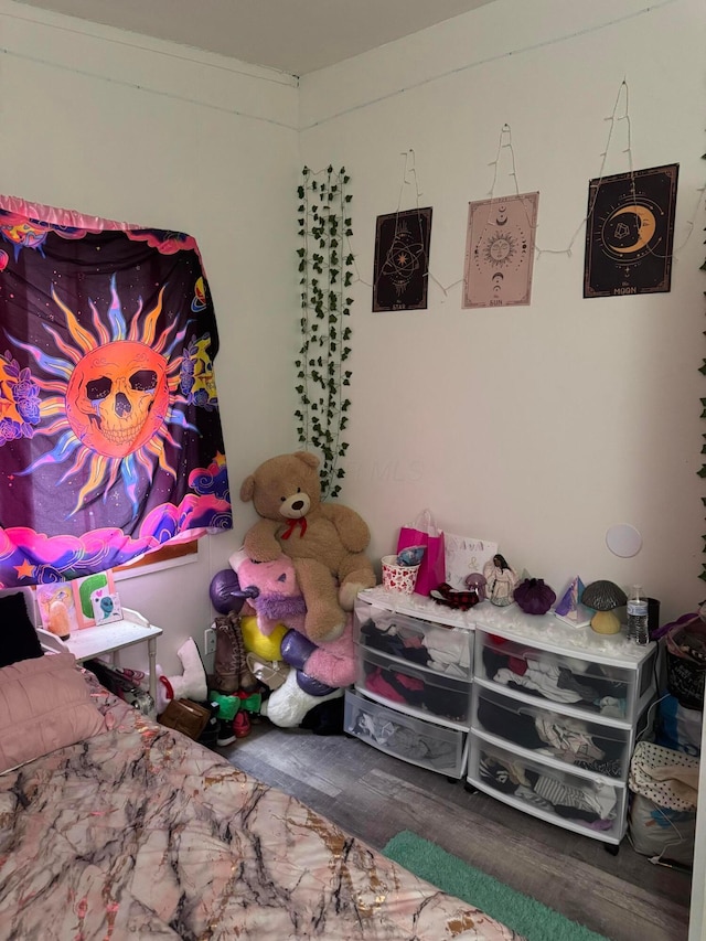 bedroom with wood-type flooring