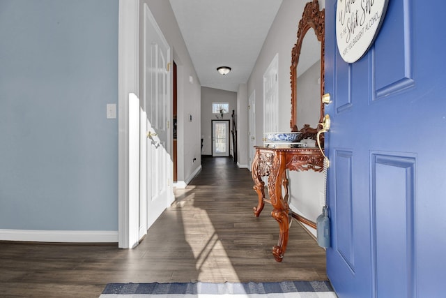 foyer entrance featuring dark hardwood / wood-style floors