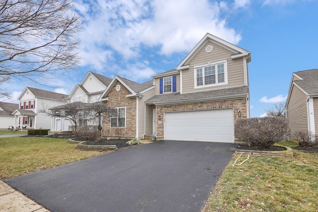 view of front of property featuring a garage and a front yard