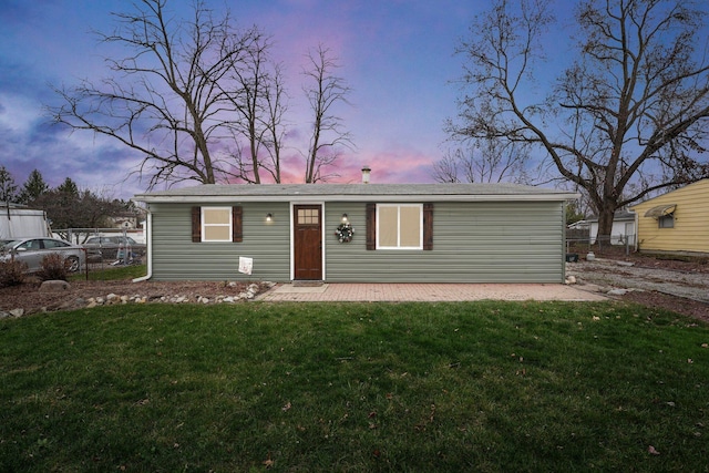 view of front of home with a yard