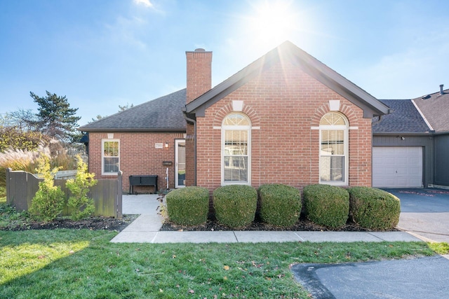 view of front facade with a front lawn and a garage