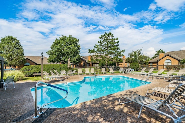 view of swimming pool with a patio area