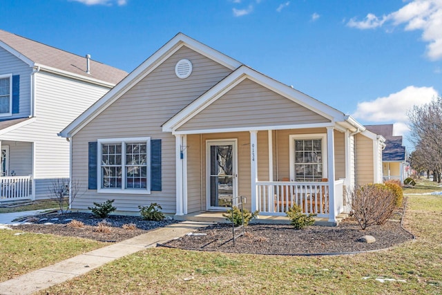 view of front facade with a porch and a front lawn