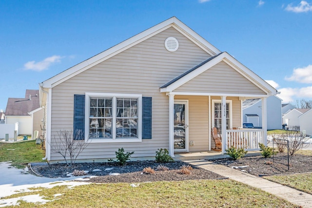 view of front of house with a front lawn and a porch