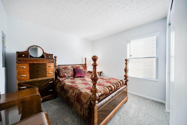 carpeted bedroom featuring a textured ceiling