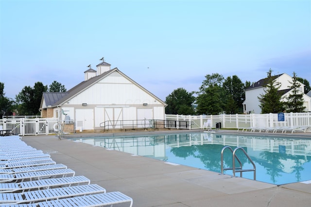 view of swimming pool featuring a patio